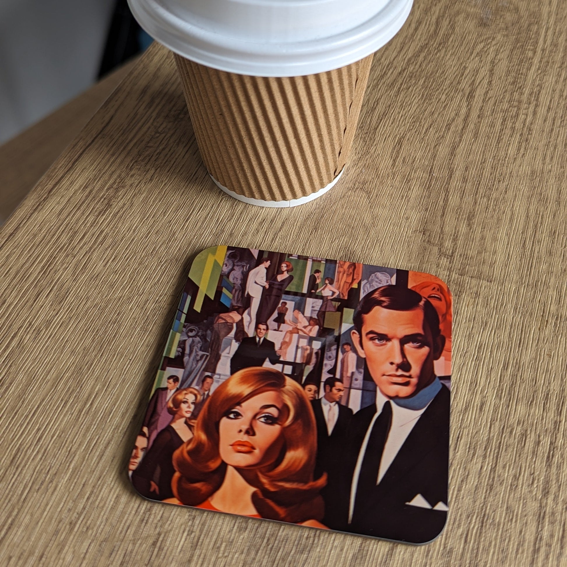 Cup of coffee with a James Bond-themed coaster on a wooden surface