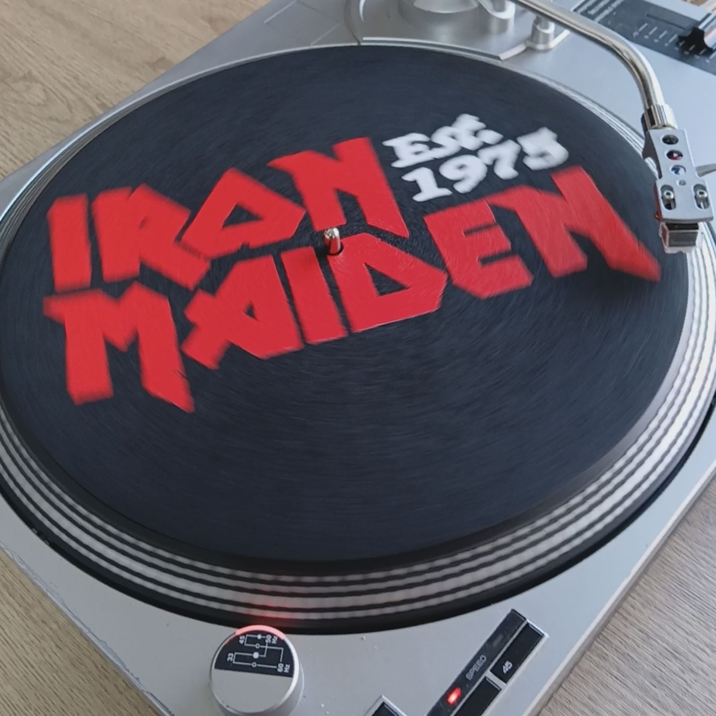Product video of the iron maiden official slipmat established 1975 on the turntable 